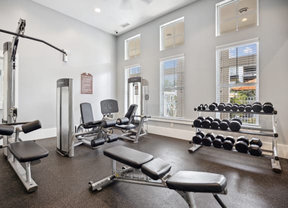 the gym with weights and equipment at the grove at cottonwood apartments
