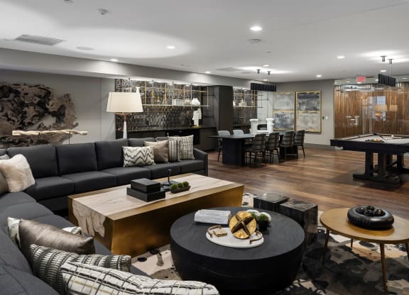 a living room with couches and tables and a pool table at Preston Centre, Columbus, OH