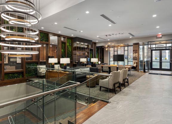 the lobby of a hotel with a large lobby area and a reception desk at Preston Centre, Columbus, OH