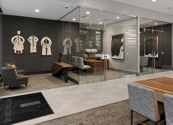 a conference room with glass walls and a table and chairs at Preston Centre, Columbus, 43215