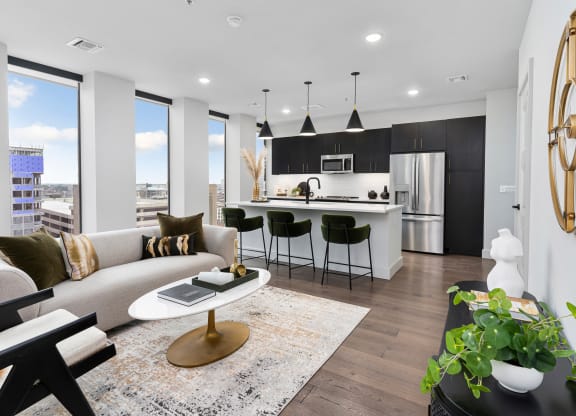 a living room with a kitchen in the backgroundat Preston Centre, Columbus Ohio