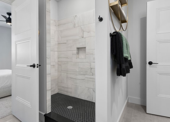 a bathroom with a shower and a bed in a roomat Preston Centre, Columbus, 43215