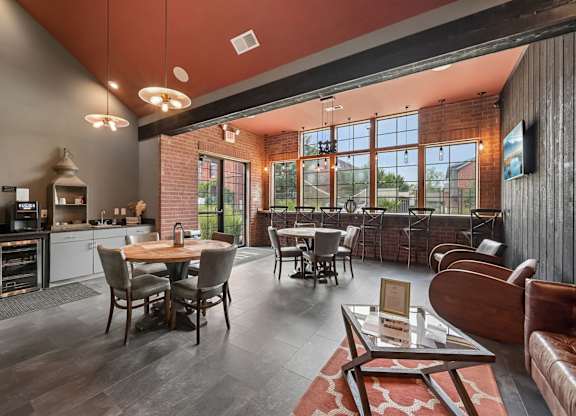 A modern kitchen and dining area with a wooden table and chairs.