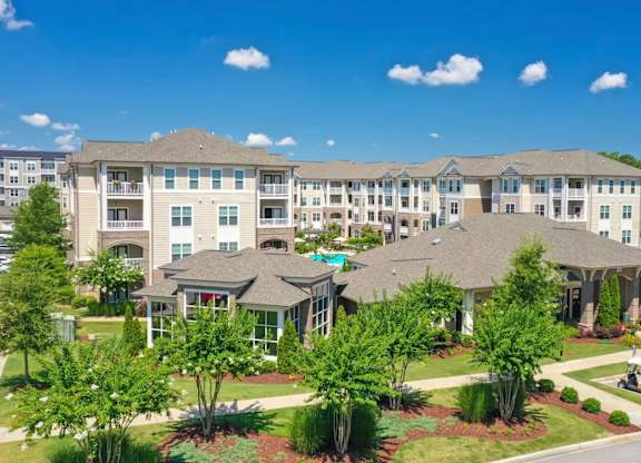 A large apartment complex with multiple buildings and landscaped gardens.