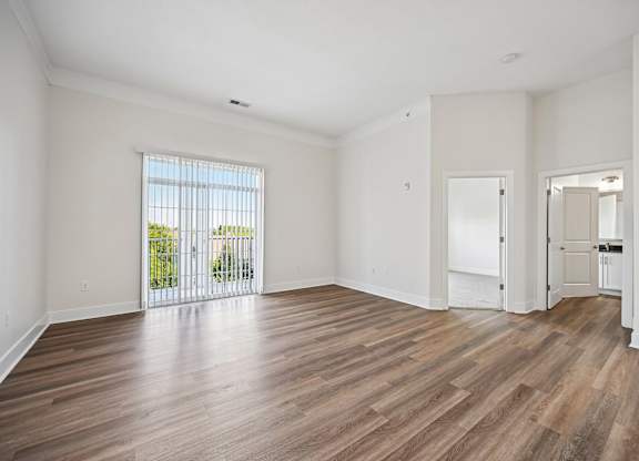 A room with wooden floors and white walls.