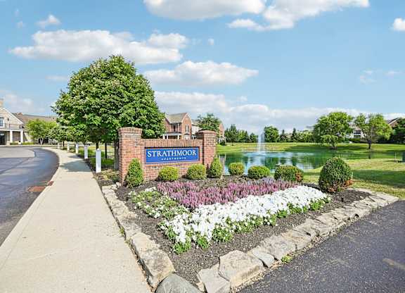 A sign that says Strathmoor in front of a building.