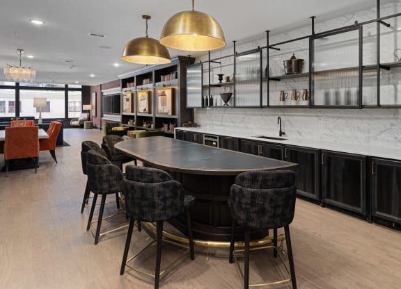 a kitchen with a large table and chairs in a restaurant at The Madison, Columbus, Ohio