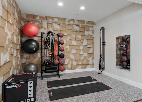 A gym room with a variety of exercise equipment. at The Orchard, Dublin, OH