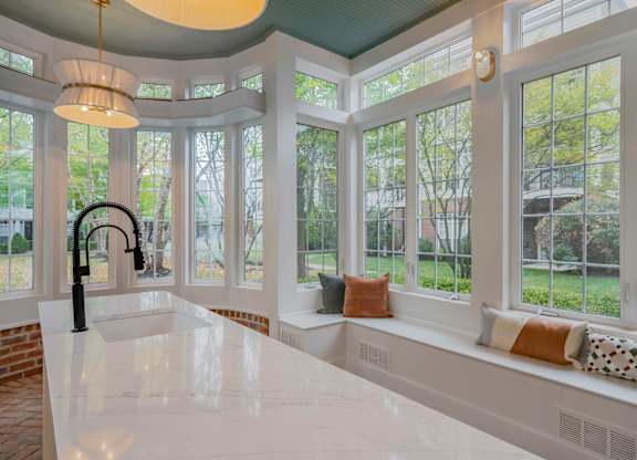 A kitchen with a large island and a window seat. at Times Square, Dublin, Ohio