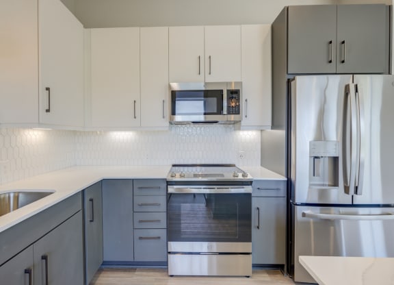 Modern Kitchen With Stainless Steel Appliances And Double Door Refrigerators at The Walker, Cary, NC