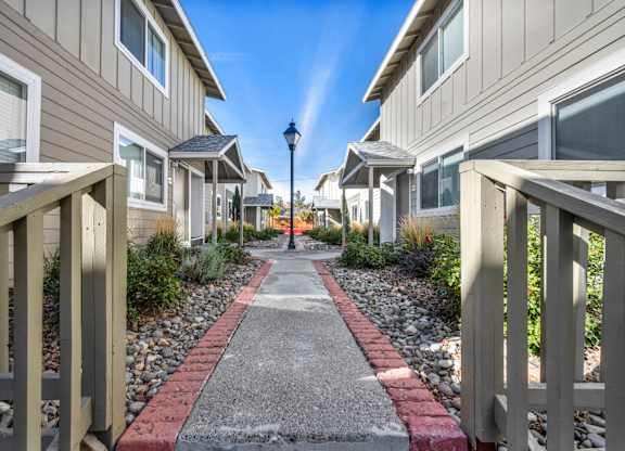 Row of houses with a pathway in between at Peaks at the Park, Nevada