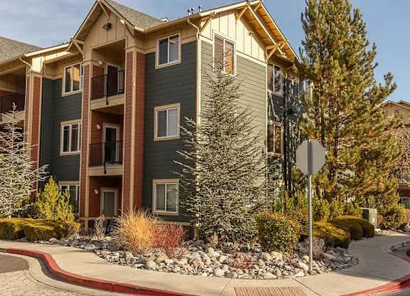 Apartment complex with a stop sign in front.