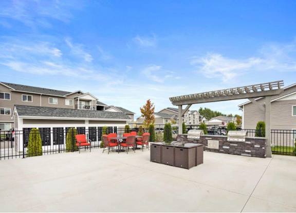 A large outdoor patio area with a fire escape ladder on the side of a building.