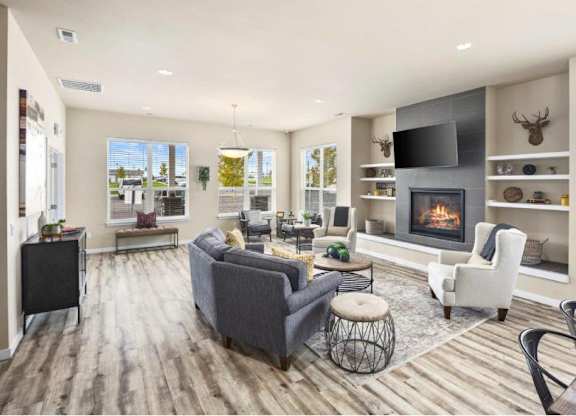 A modern living room with a fireplace and a television.