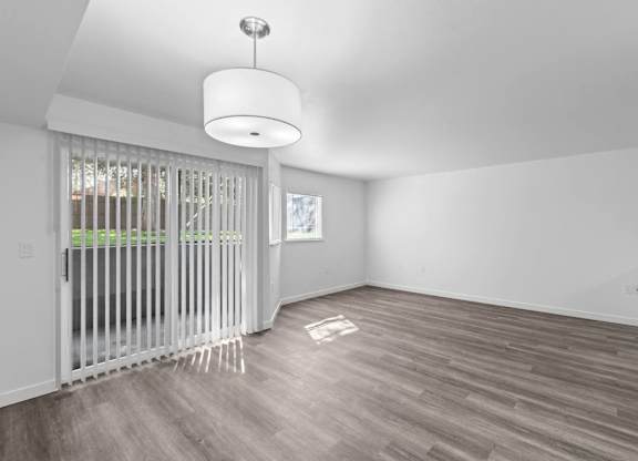 A room with a sliding door and a light fixture.