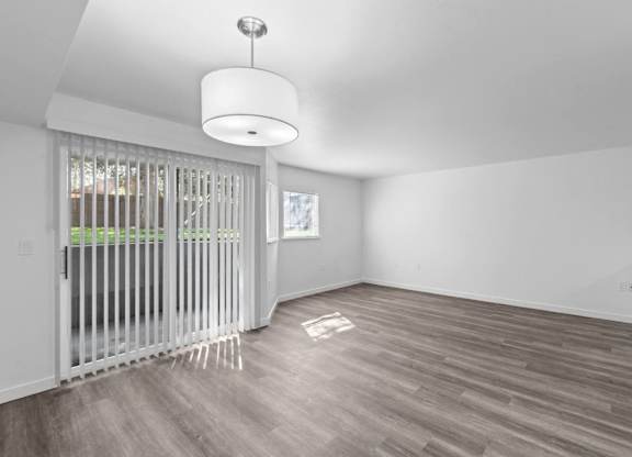 A room with a sliding door and a light fixture.