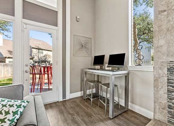 Home office nook with dual monitor workspace at Polo Club Apartments, Austin