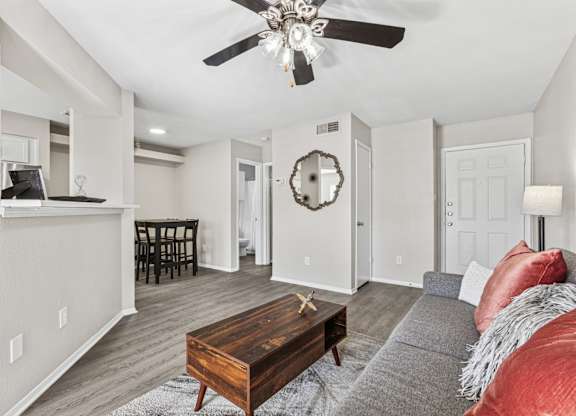 Open concept living room with dining area and kitchen at Polo Club Apartments, Texas