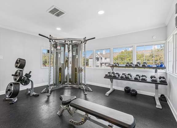 Fitness center with cable machine at Polo Club Apartments, Austin, TX 78729