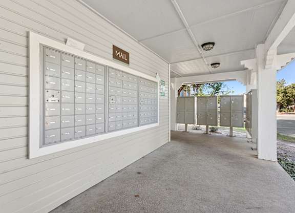 Covered mailbox area with secure parcel lockers at Polo Club Apartments, Austin, TX