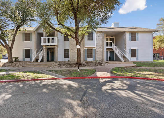 Two story apartment building with exterior staircases at Polo Club Apartments, Austin, Texas