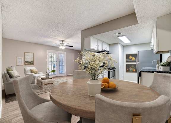Open dining area with kitchen space at Peaks at Universal City Apartments, Universal City