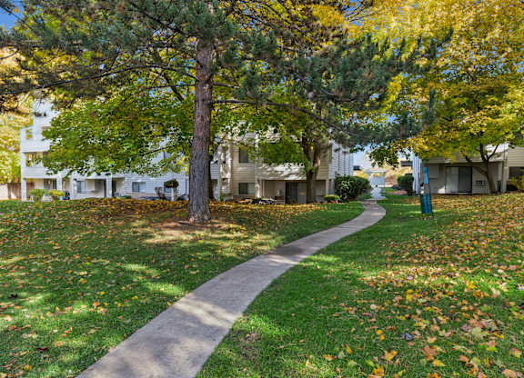 Pathway surrounded by lawn area at Peaks on Pines, Spokane Valley, WA