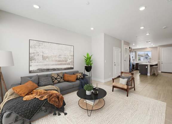 A Living Room with a Grey Couch at Montessa Apartments, Vacaville, 95687