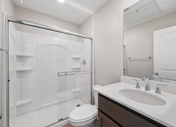 A White Bathroom with a Sink at Montessa Apartments, Vacaville, CA