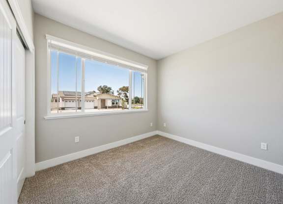 A Room with a Large Window at Montessa Apartments, California