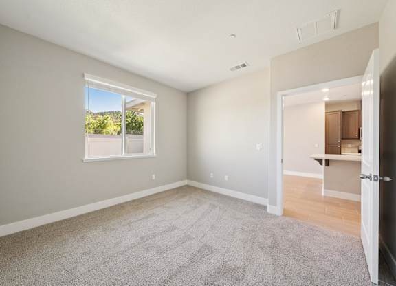 A Room with a Carpeted Floor at Montessa Apartments, California, 95687