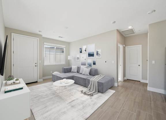 Living Room with a White Coffee Table at Montessa Apartments, Vacaville, CA