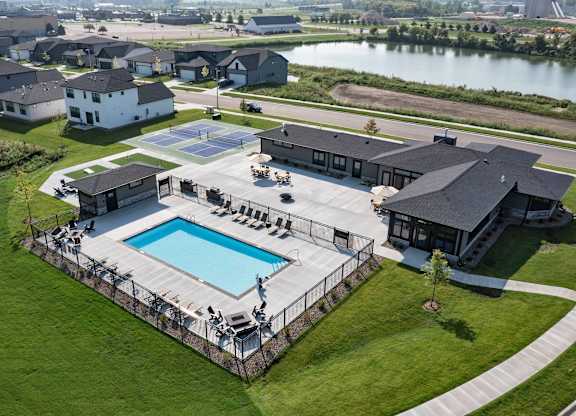 A large house with a pool in the backyard.