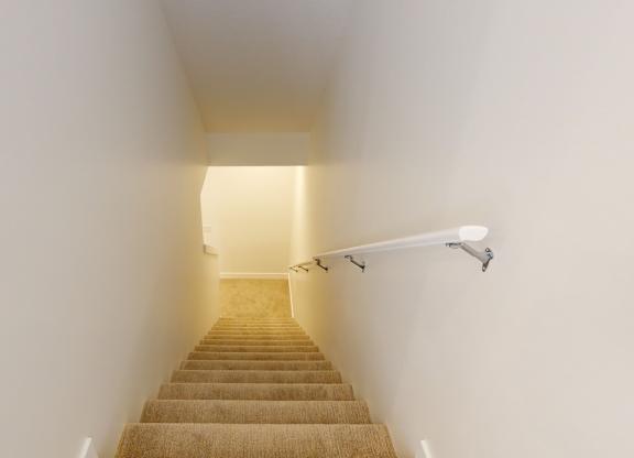 A staircase with a light at the top.