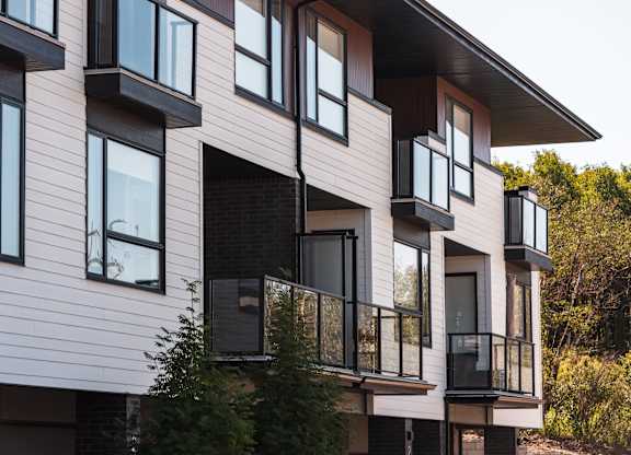 A modern building with balconies and windows.