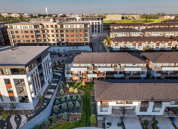 A modern residential complex with a mix of apartment buildings and townhouses.