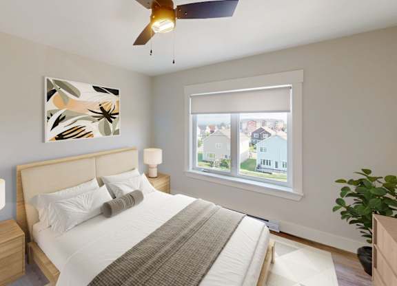 A bedroom with a bed, a ceiling fan, and a window with a view of a residential area.