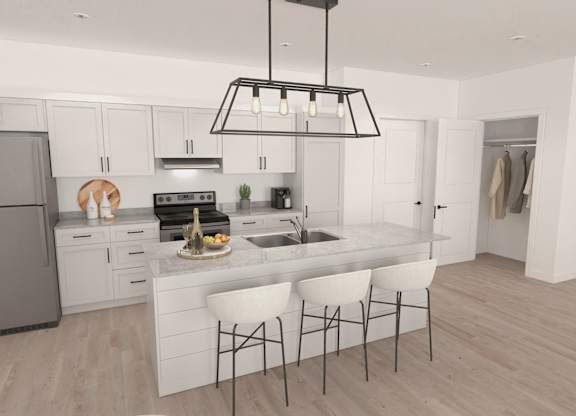 A modern kitchen with a large island and white cabinets.