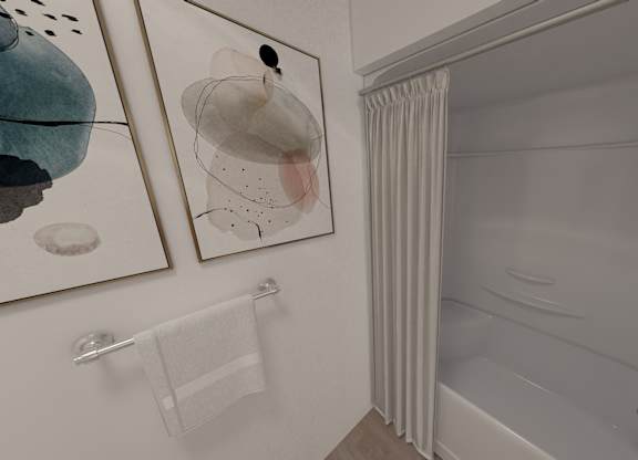 A bathroom with a towel rack and two pictures on the wall.