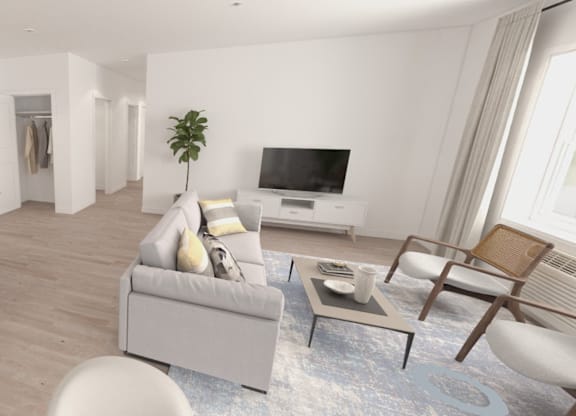 A modern kitchen with a bar area and a living room with a couch and chairs.
