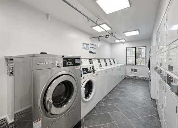 A row of washing machines in a laundromat.