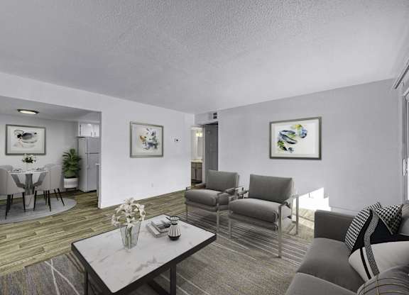 A living room with a grey couch and a coffee table.