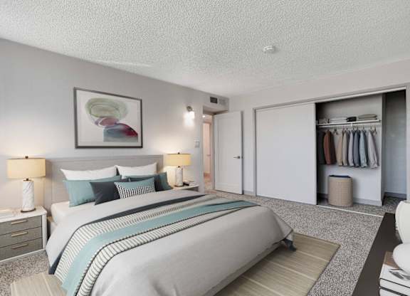 A bedroom with a large bed and a painting on the wall.