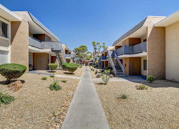 A row of modern houses with balconies and staircases.
