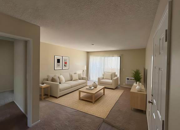 A living room with a couch, armchair, and coffee table.