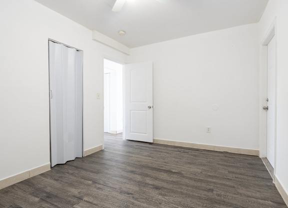 A room with a grey floor and white walls.