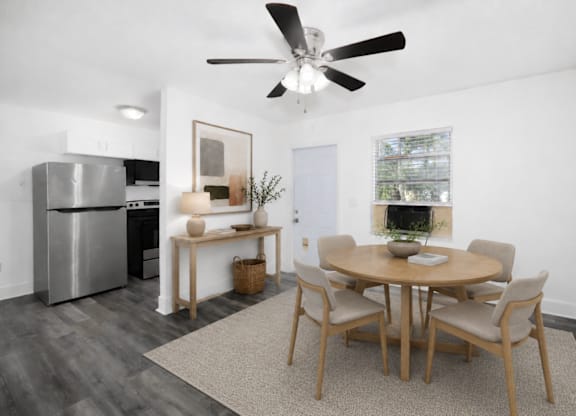 A modern dining room with a table set for six.