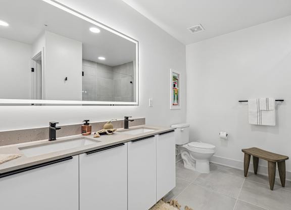 Dual bathroom vanities with quartz countertops