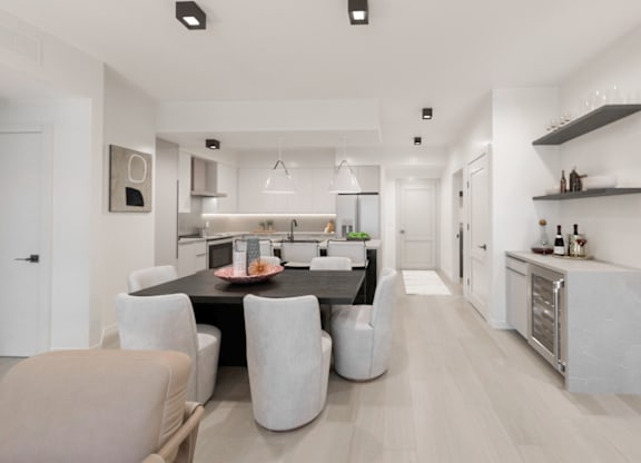 A modern kitchen with a dining table and chairs.