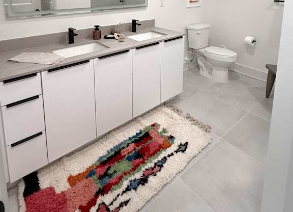 Dual bathroom vanities with quartz countertops